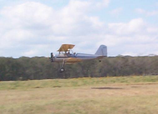 The Meyers making a low pass over the runway
