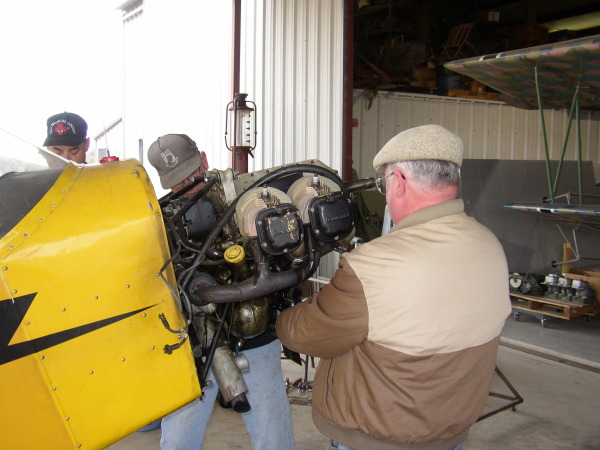 Ted and Mike work on the Cub engine
