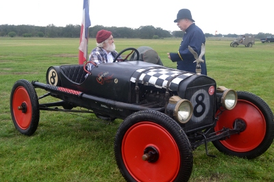 Al Sumrall writing a speeding ticket to a racer